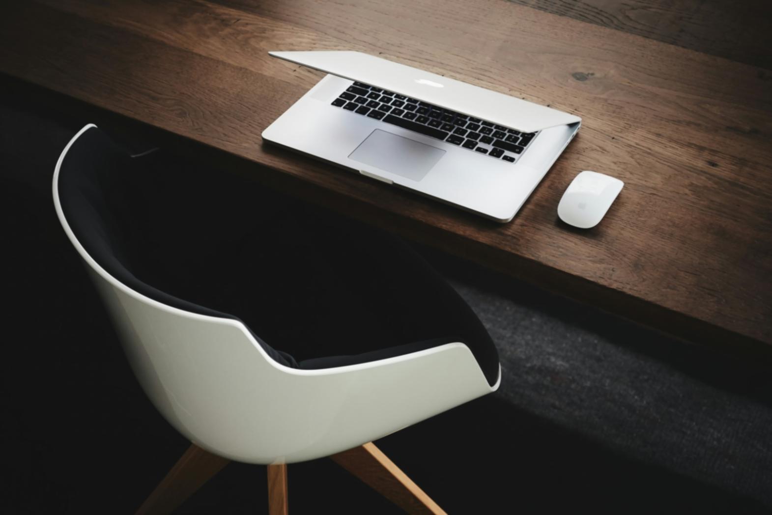 Modern web development workspace with multiple screens showing code and design interfaces